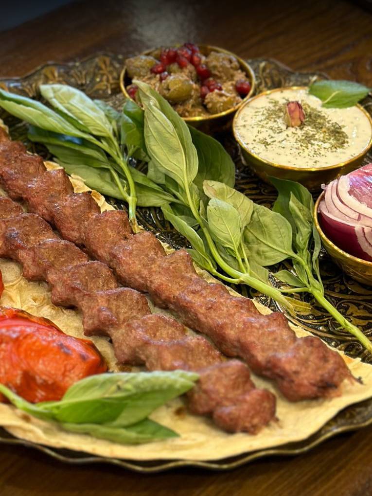Park Way Persian platter with chicken and lamb kebabs, grilled tomatoes, and dip in Chorlton. 